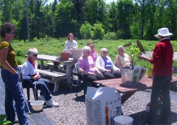 Members enjoy a beautiful June day at the Greenhouse